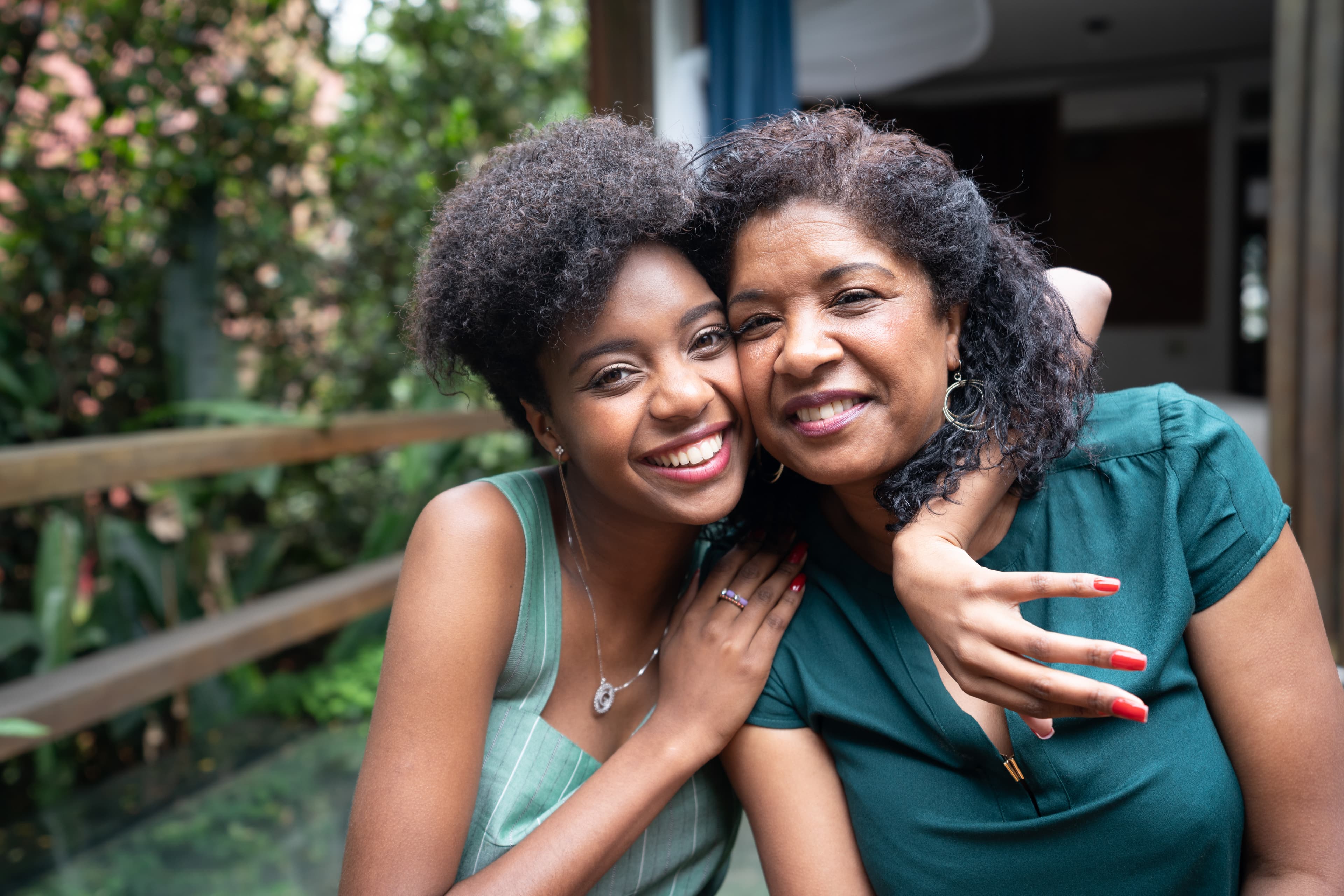 Mother and Daughter Hugging outside