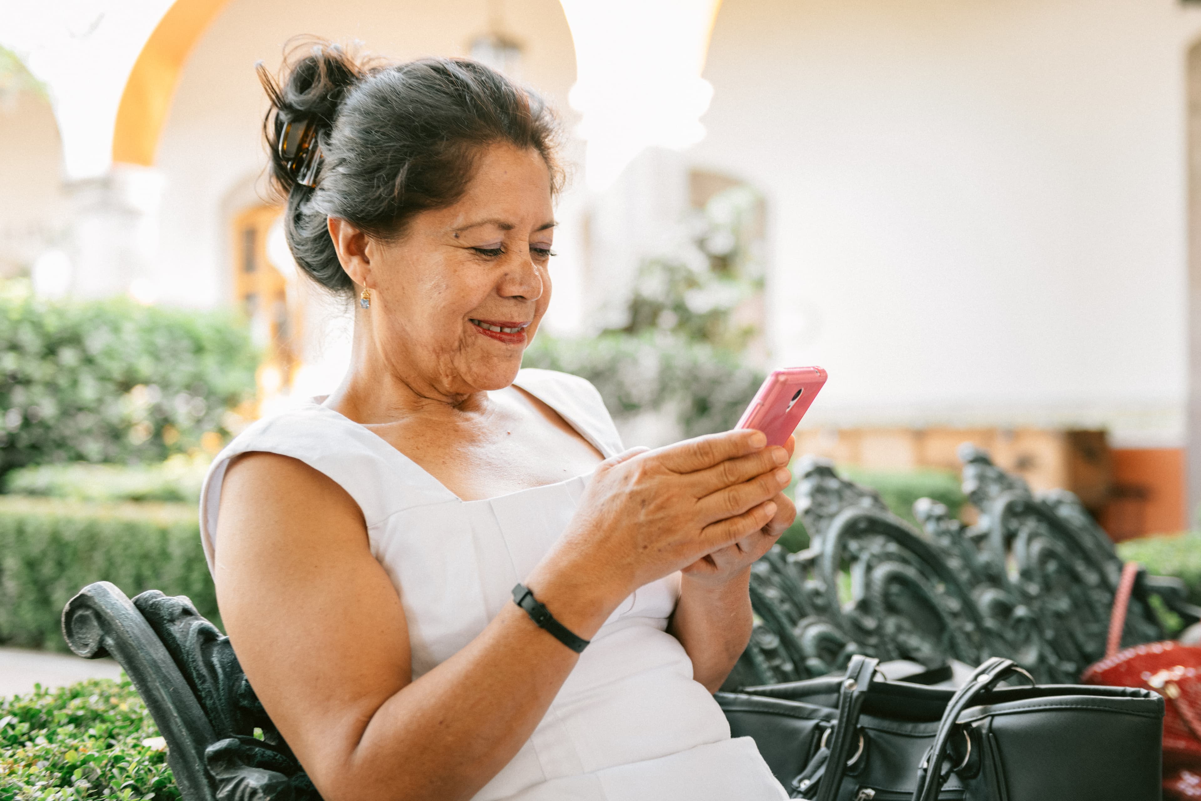 Senior Mexican Woman Using Smart Phone