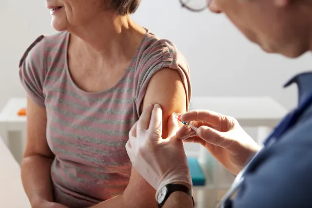 shot woman immunization 