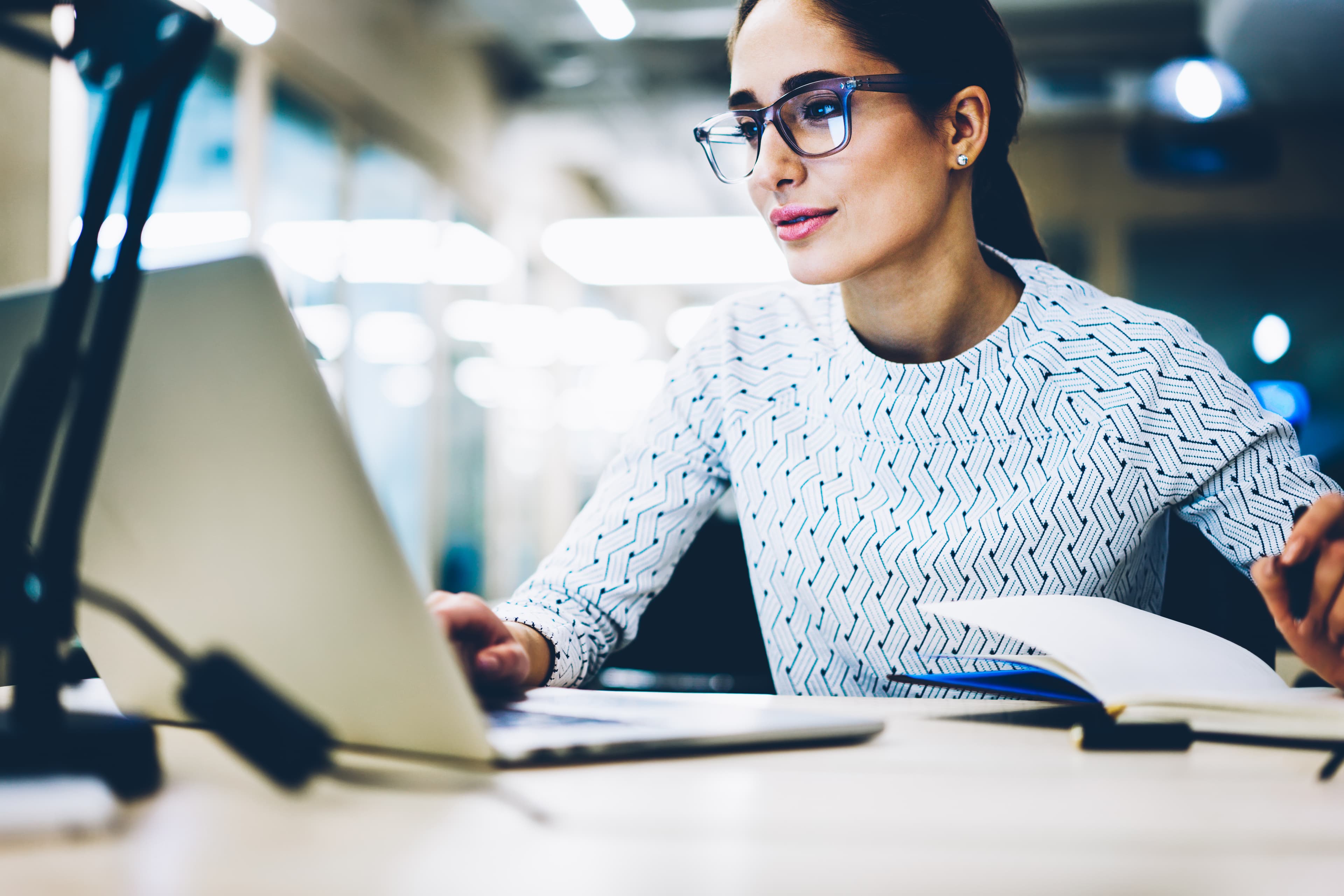 Experienced businesswoman reading publication via laptop computer making research for planning startup at desktop,female secretary checking mail on netbook organizing working process in office