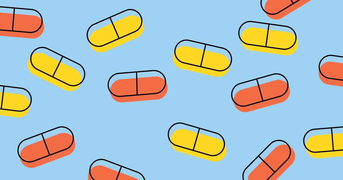 Orange and yellow pills on a blue background