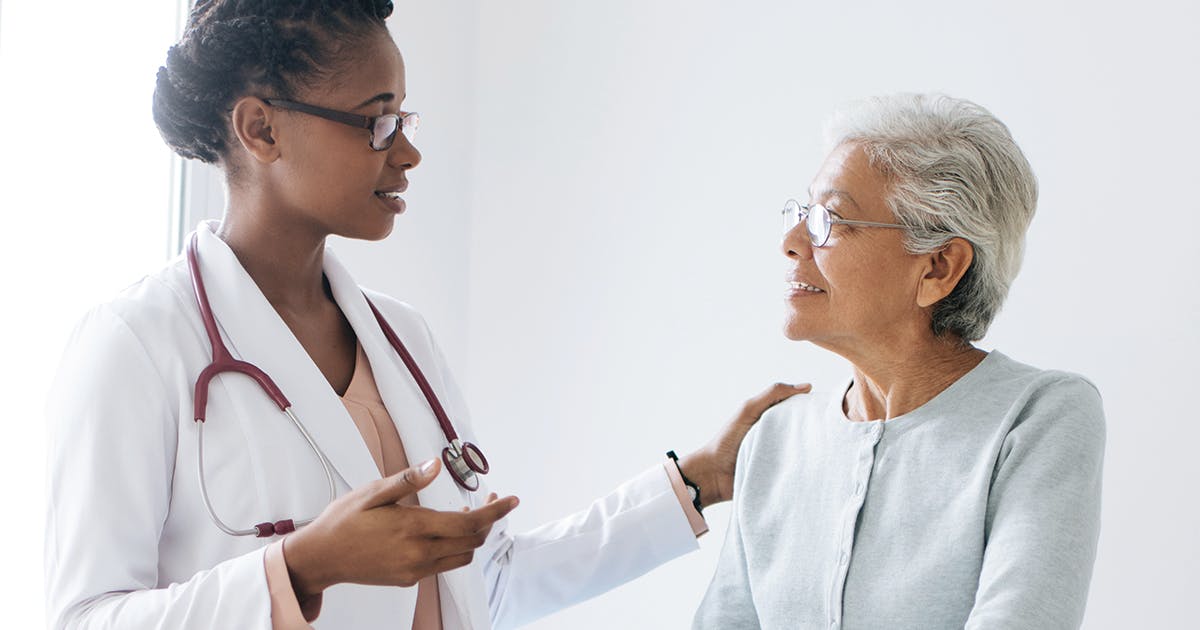 A doctor talking to her female patient.