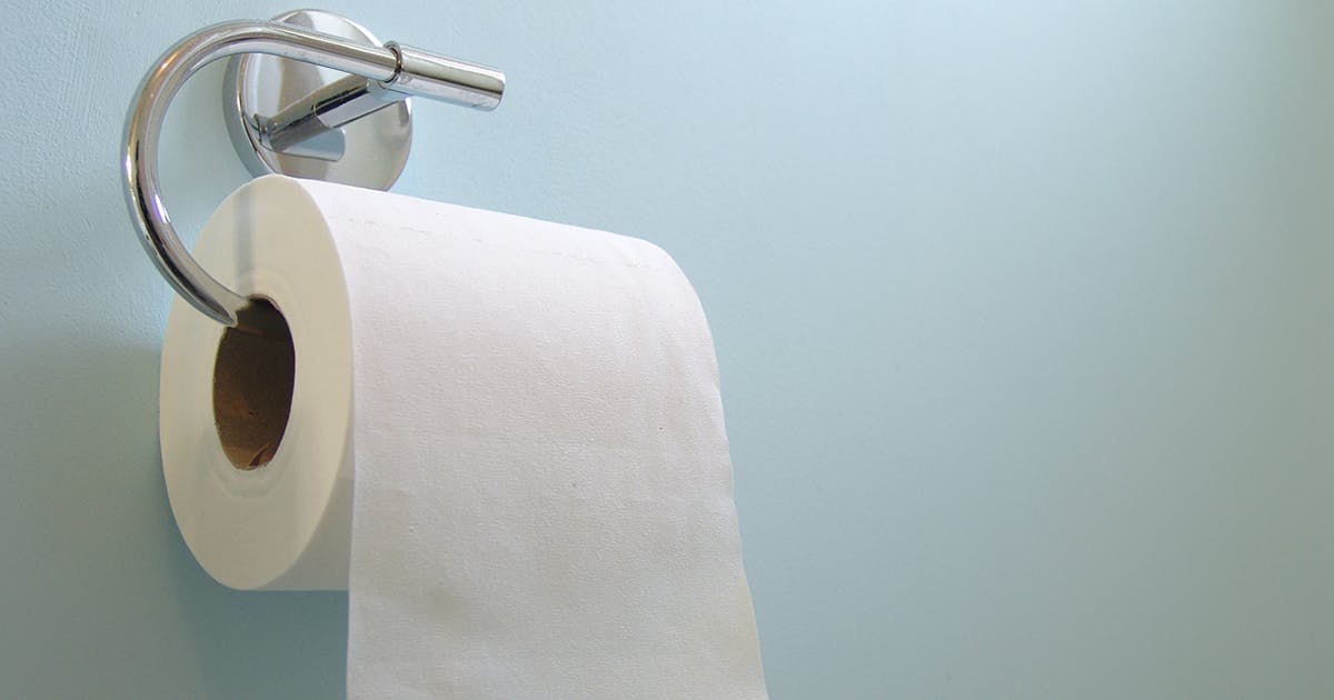 A roll of toilet paper on the holder.