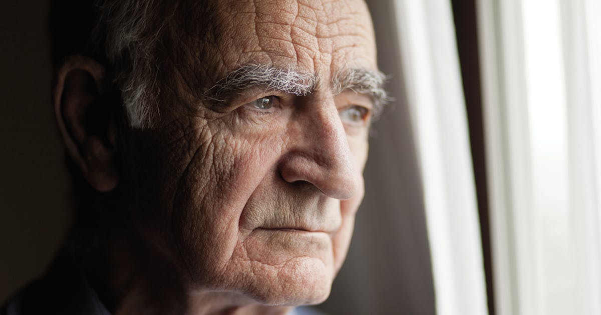 A close-up of a face of an older man.