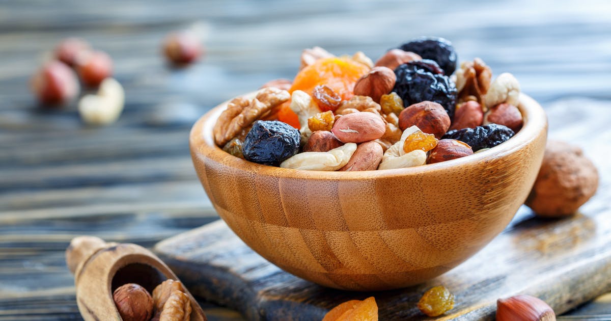 A bowl of nuts and dried fruit.