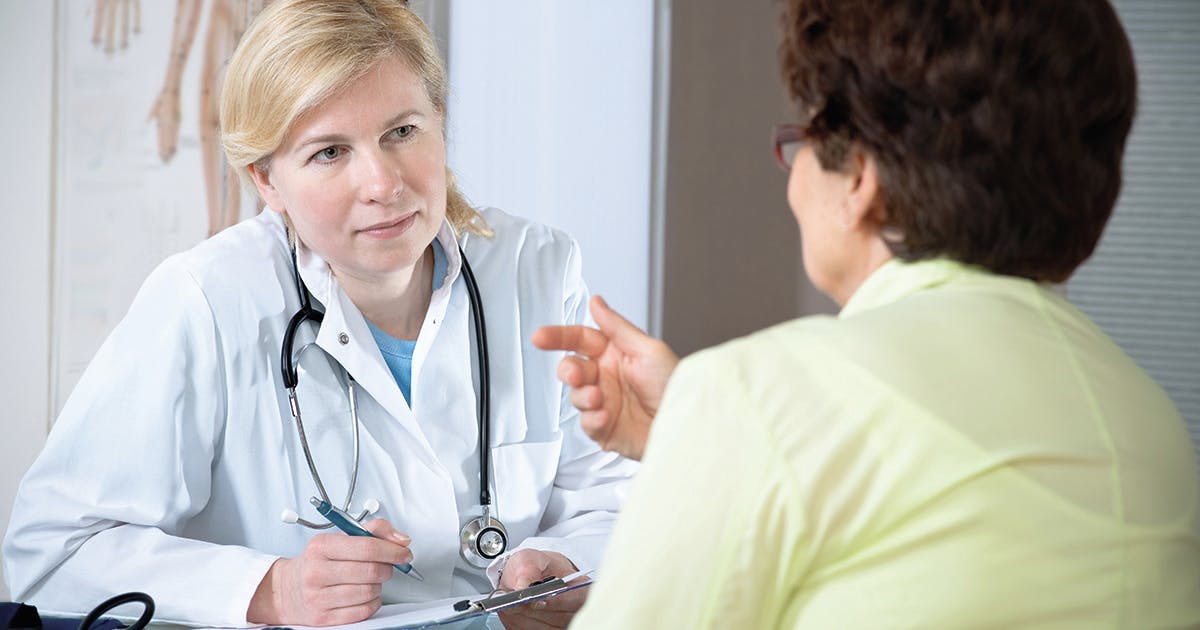 A women is talking to her doctor.