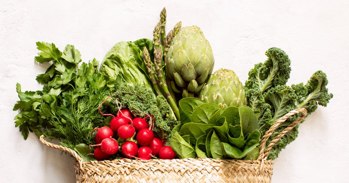 A variety of vegetables in a woven basket